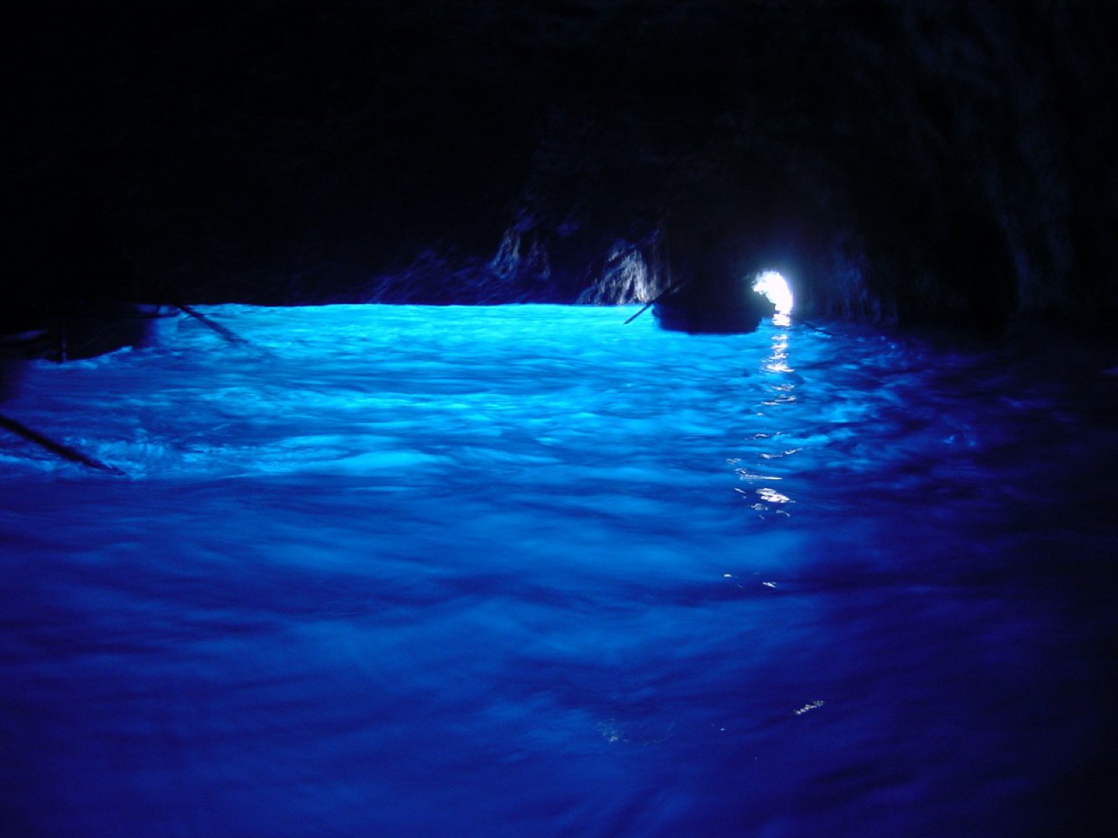 Blue light glowing inside the Blue Grotto of Capri